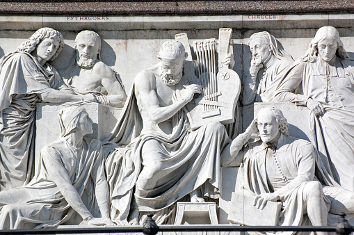 Stone frieze showing various artistic heros of Victorian England with Homer in the centre and also including Chaucer, Shakespeare, Virgil, Dante and Pythagoras on the Albert Memorial in Hyde Park, Kensington, London.