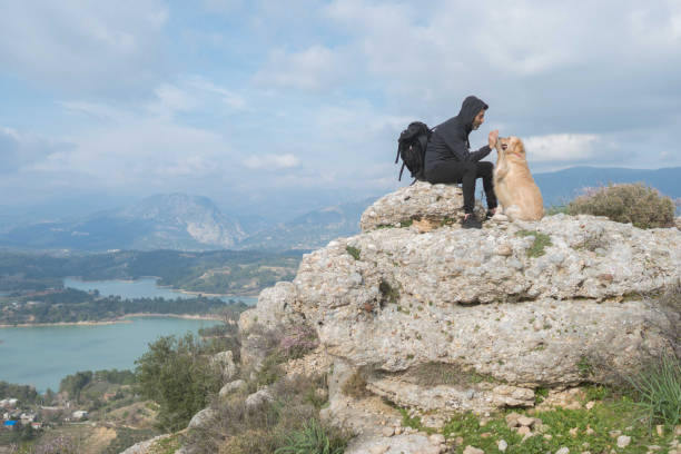 istock Trekking with the dog on mountains. 1303124808