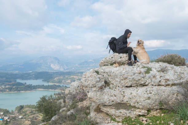 istock Trekking with the dog on mountains. 1303124818