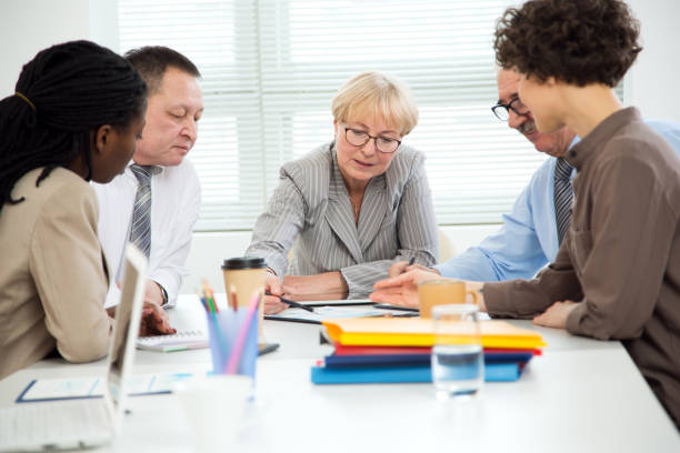 istock Business people working together in the office 1303125753