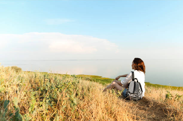 istock Calm woman on hill during sunset 1303126006