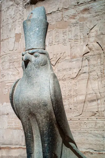 Horus of Edfu called Hor-Behdeti Statue, a Granite Sculpture of the Falcon God wearing the Crowns of Upper and Lower Egypt at the Temple Entrance