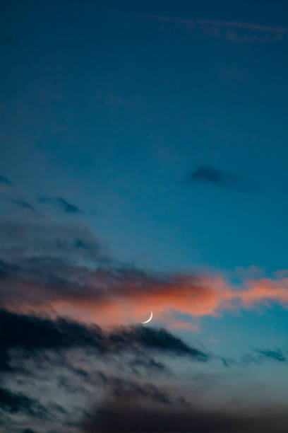 istock The crooked moon hangs in the sky 1303127233