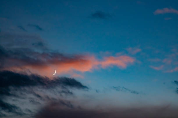 istock The crooked moon hangs in the sky 1303127256