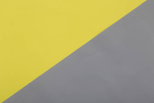 istock Illuminating yellow and Ultimate Gray pastel paper texture background, Geometric flat lay background 1303130854