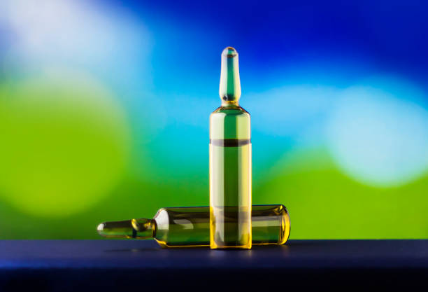 Medical ampoules on blurred background with bokeh.