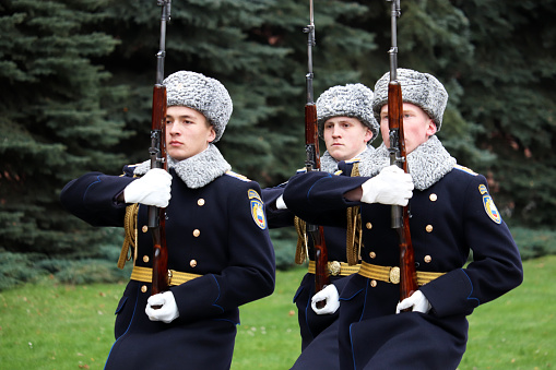 Moscow, Russia - February 2021: Russian soldiers on march, change of the honor guard of the Presidential regiment of Russia near the Kremlin wall in Moscow