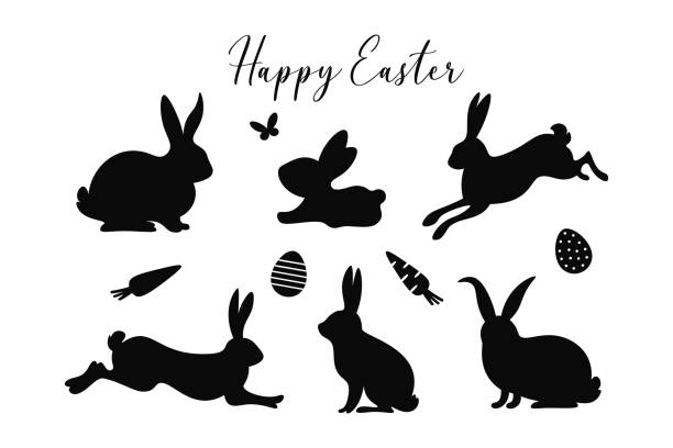 Easter bunny silhouettes set. Happy Easter. Cute spring bunnies with butterfly, eggs, carrots and text. Easter designs. Easter bunny silhouettes set. Happy Easter. Cute spring bunnies with butterfly, eggs, carrots and text. Black silhouettes isolated on white background. Easter designs. silhouette of a black and white rabbit stock illustrations