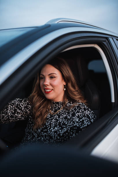 istock Young woman driving a car 1303134226