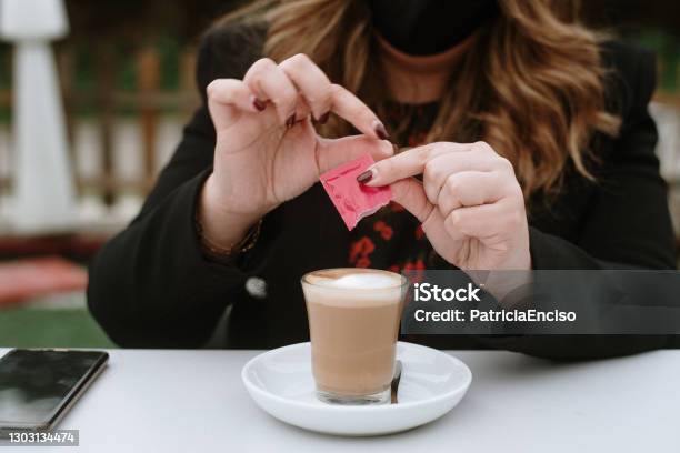 Young Woman Having A Coffee Stock Photo - Download Image Now - Artificial Sweetener, Sugar - Food, Coffee - Drink
