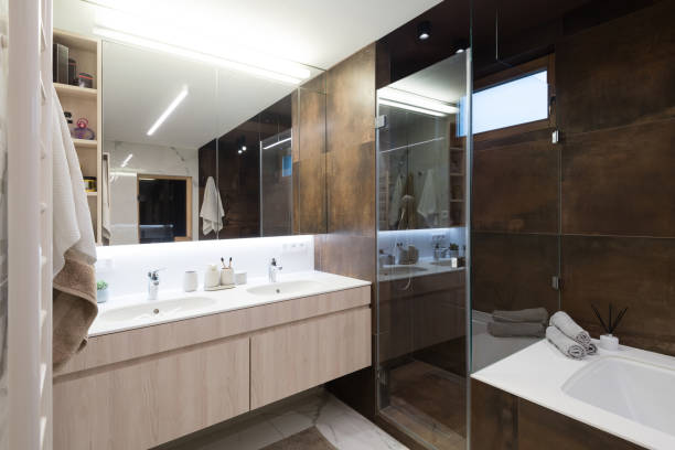istock Interior of modern bathroom with bathtub and shower 1303135558