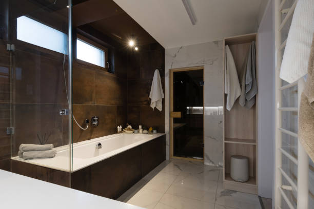 istock Interior of modern bathroom with bathtub and shower 1303135606