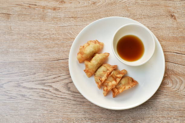 istock crispy fried Gyoza or Japanese dumpling stuffed mashed pork dipping shoyu sauce 1303136905