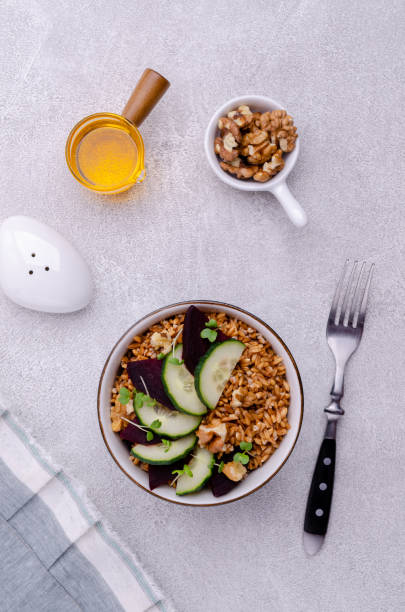 Wheat with vegetables Wheat with vegetables in a ceramic bowl on a cement background. Selective focus. kosher starter recipes stock pictures, royalty-free photos & images
