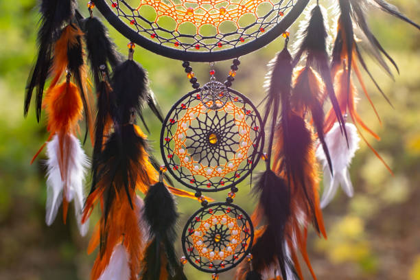 istock Handmade dream catcher with feathers threads and beads rope hanging 1303139976
