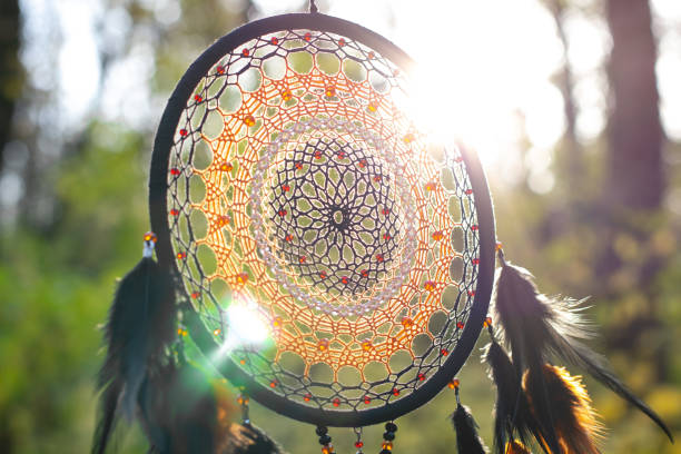 istock Handmade dream catcher with feathers threads and beads rope hanging 1303139978