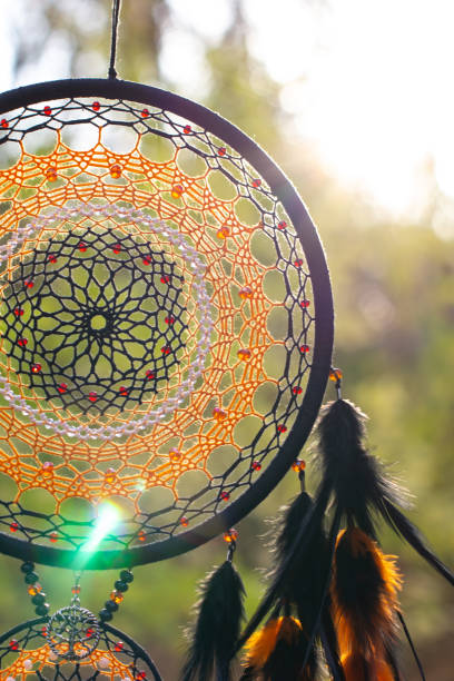 istock Handmade dream catcher with feathers threads and beads rope hanging 1303140003