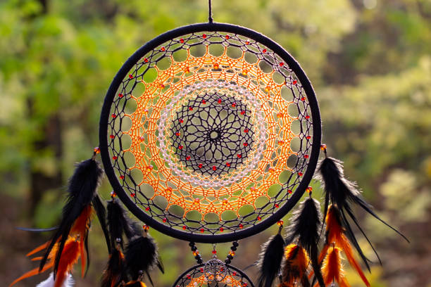 istock Handmade dream catcher with feathers threads and beads rope hanging 1303140010