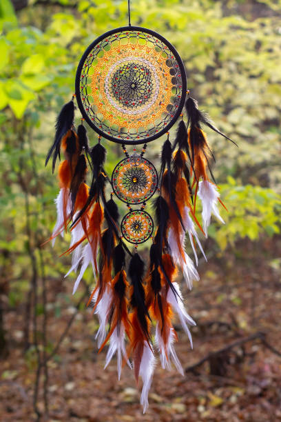 istock Handmade dream catcher with feathers threads and beads rope hanging 1303140018