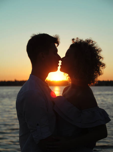 istock Happy in love couple dancing at sunset on the beach 1303140914