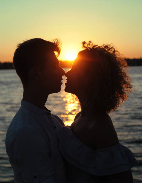 istock Happy in love couple dancing at sunset on the beach 1303140943