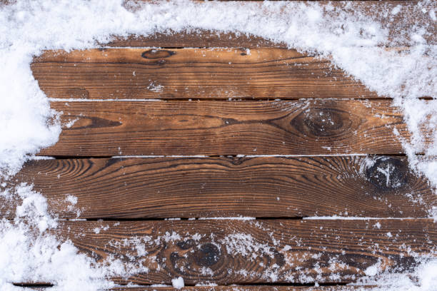 Winter background. Empty wooden plank with snow border, copy space for text