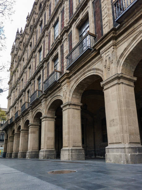 istock Colonial facade with arch in mexico city 1303142285