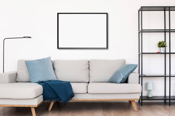 istock Frame for artwork mockup on white wall. Living room design 1303144323