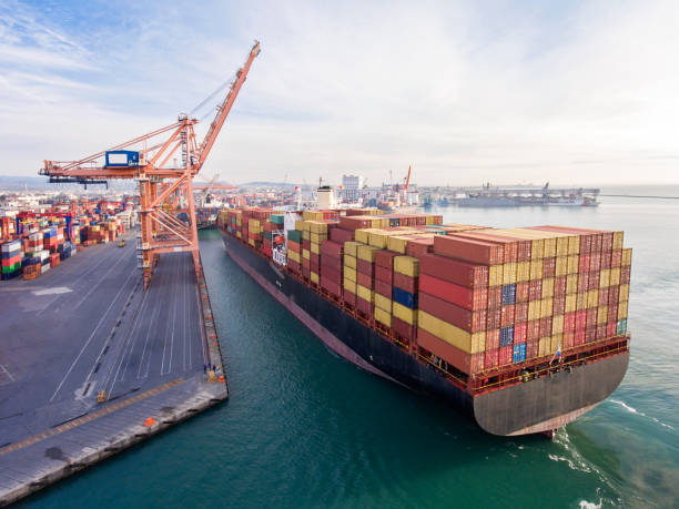 istock Aerial view of cargo ship in transit. 1303145570