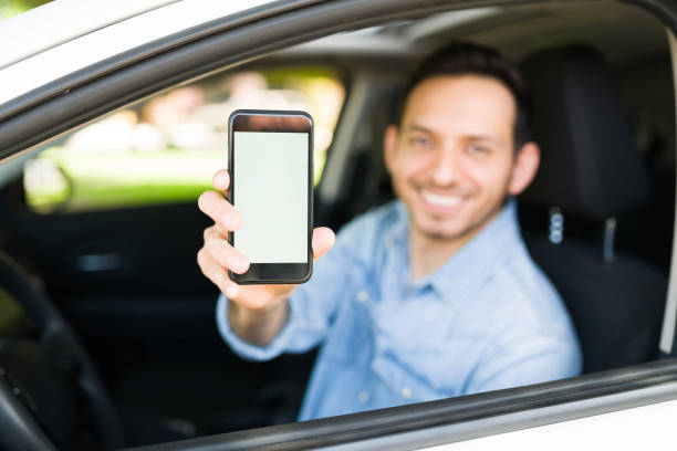 istock Male driver picking up a customer of a car sharing service 1303145810