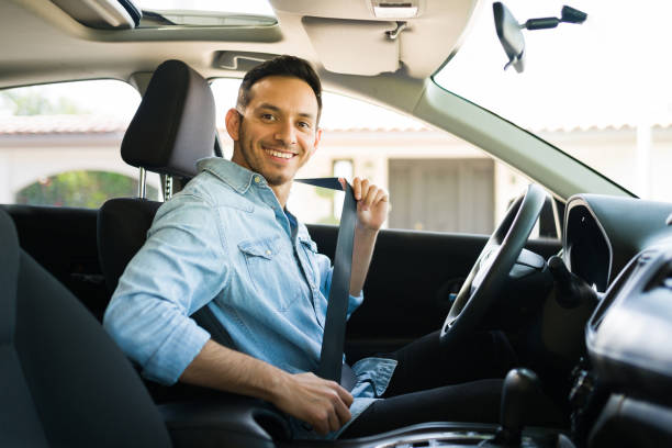 istock Hispanic taxi driver preparing to go out for a drive 1303145853