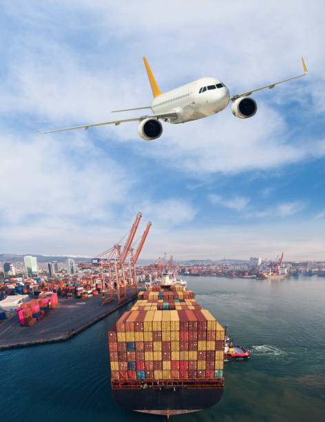 istock Airplane flying above the container ship. Transportation concept. 1303147743