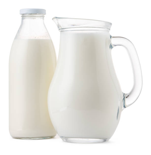 istock Glassware full of fresh milk isolated on white 1303147851
