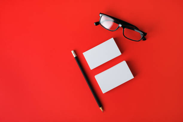 istock Business cards, pencil and glasses 1303148294