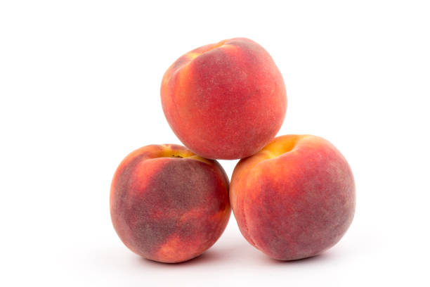 Summer peach fruit background. Ripe juicy peaches on white background. Copy space.