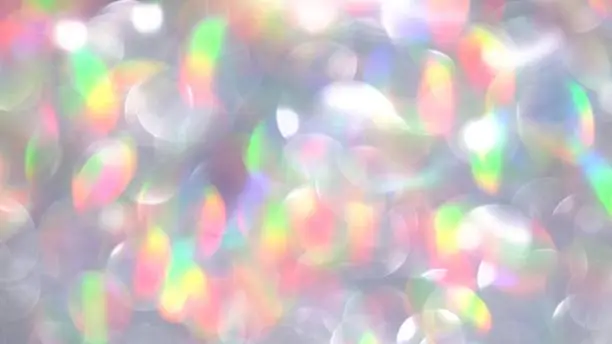 Photo of Holographic glitter. Magic circles lights abstract background. Blurred colorful light dots