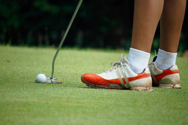 istock Golfers are playing golf in the evening golf course 1303154066