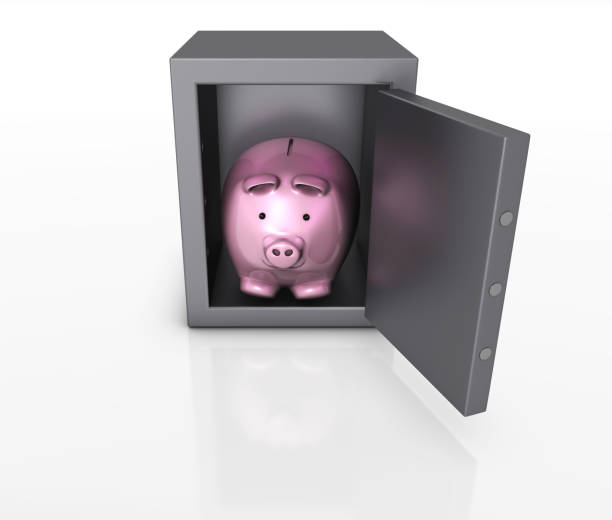 istock Piggy bank in vault 1303154084