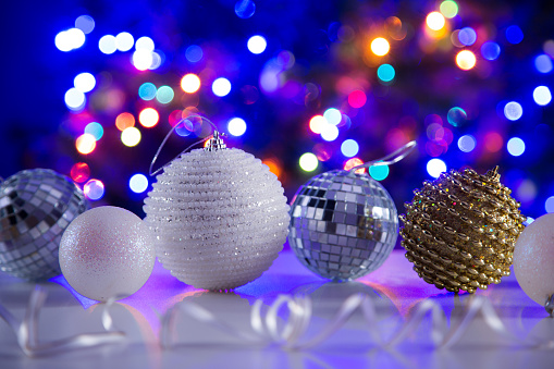 Christmas balls against the backdrop of a festive Christmas tree.