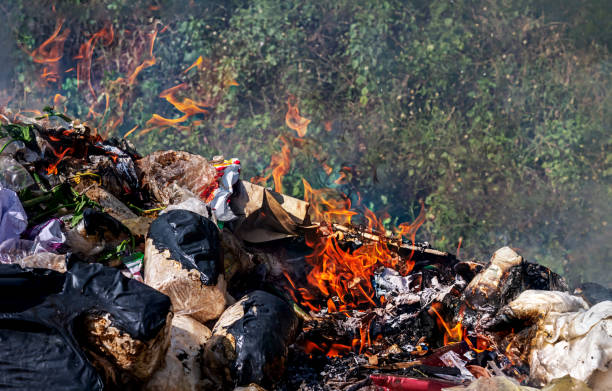 istock fire burn garbage waste plastic, smoke polluted of waste plastic incineration, garbage waste disposal with burnt incinerate, fire flame garbage burning and smoke air pollution 1303155881