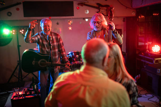 istock Band playing music while senior couple dancing on dance floor 1303156659