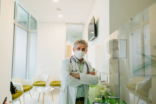 istock Doctor with a protective face mask at the clinic 1303156698