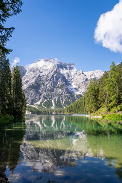 istock Alpine lake reflex in a blu sky 1303156892