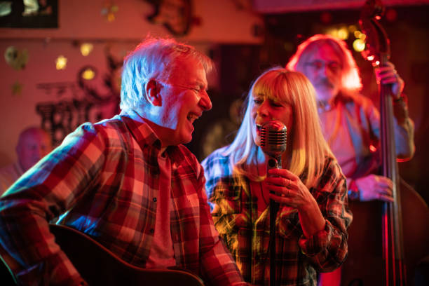 istock Two musicians from band singing together on stage during gig 1303156899