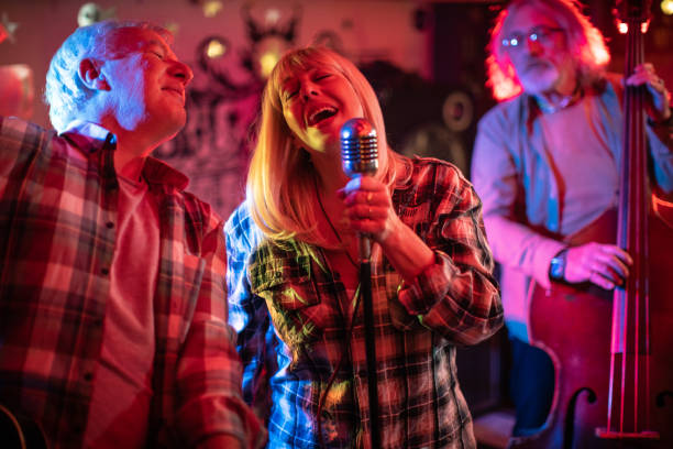istock Two musicians from band singing together on stage during gig 1303156914