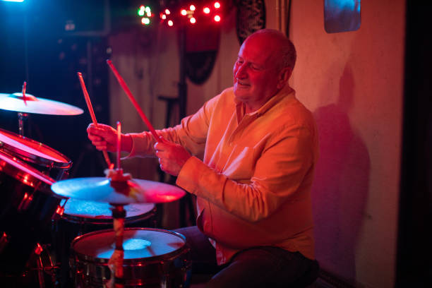 istock Drummer plays the drums during gig in nightclub 1303156992