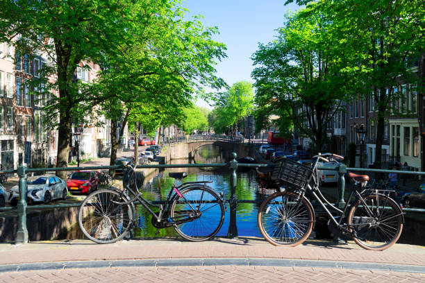 istock Orange bicycle next to canal of Amsterdam 1303159685