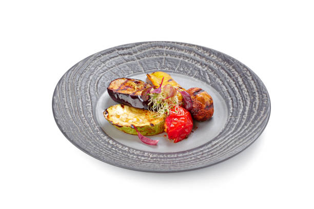 istock Grilled vegetables served on plate isolated on white 1303160199