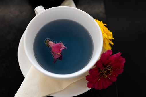 Herbal Blue tea, or butterfly pea flower tea, is a caffeine-free herbal concoction, made by seeping dried or fresh leaves of the Clitoria ternatea plant.