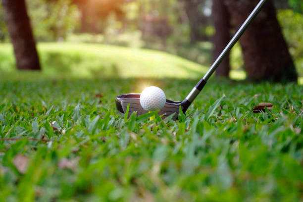istock Golf ball and golf club in beautiful golf course 1303162142